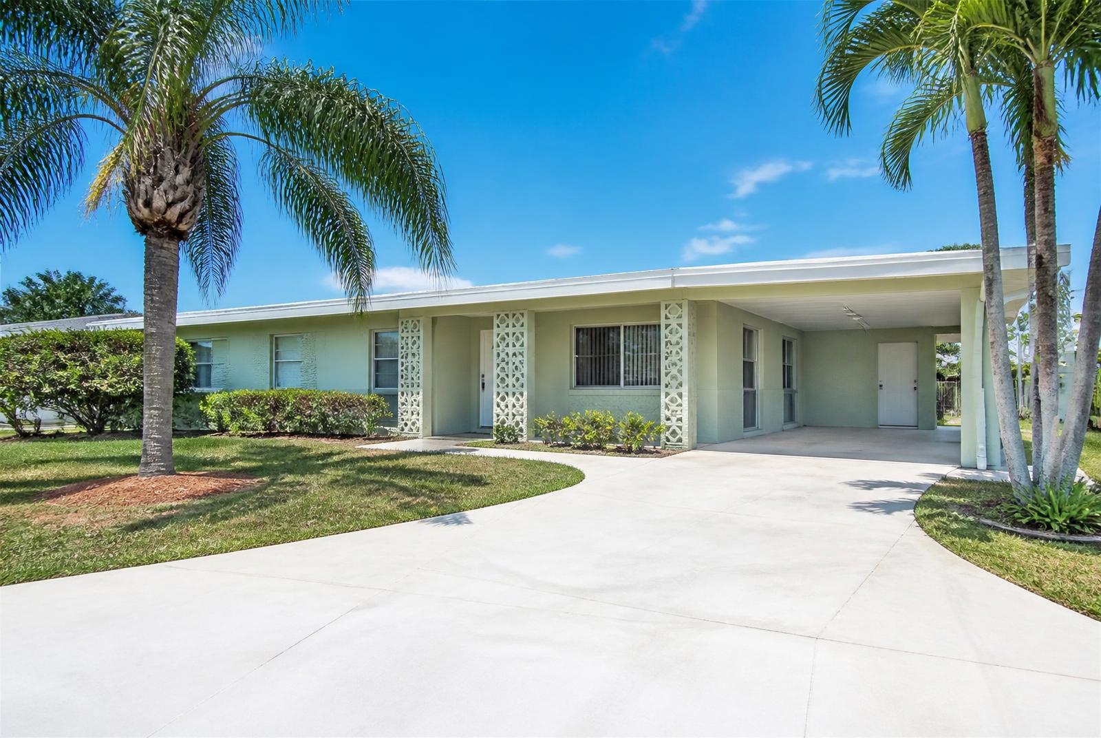Front exterior of the Margate single-family pool home